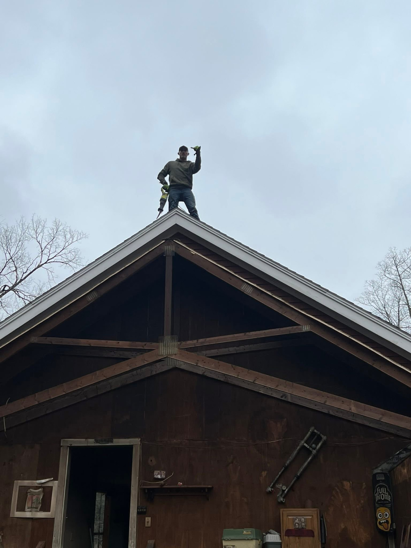Roof and framing work on a garage with new ridge and trim